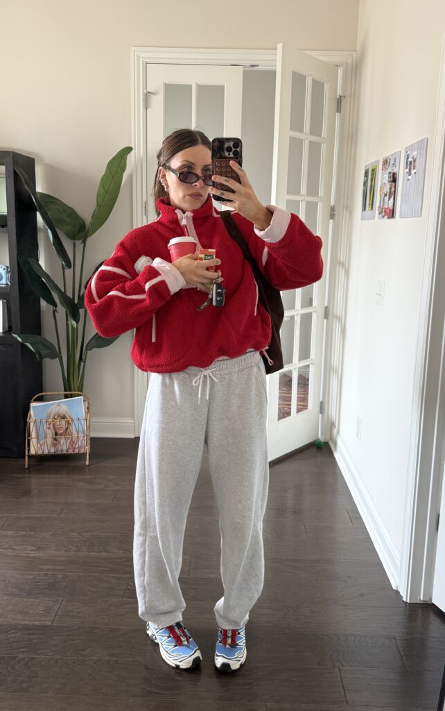 Elevated casual outfit with gray sweatpants, a fleece jacket, sneakers, sunglasses, and a crossbody bag