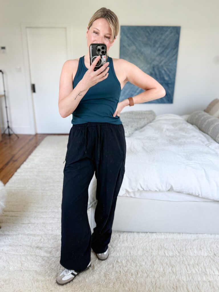Beyond Yoga Peak pant with a high waistband and cinchable hems, shown worn straight-leg